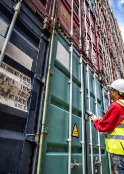 Foreman control loading Containers box to truck for Logistic Import Export Background, Business logistic concept, import and export concept.
