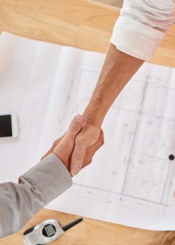 Firm handshake of contractor and head engineer